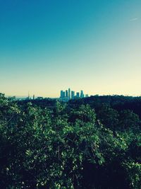 View of cityscape against blue sky