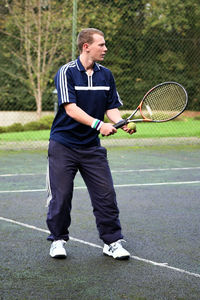Full length of man playing with ball