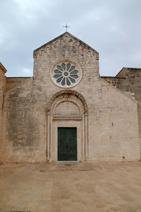 Low angle view of old building against sky