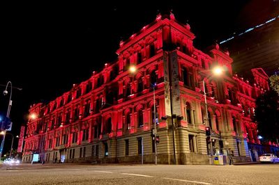 Low angle view of illuminated building at night