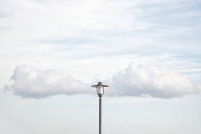 Low angle view of street light against sky