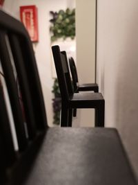 Empty chairs and table in house