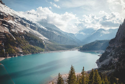 Scenic view of lake and mountains against sky