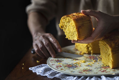 Midsection of man preparing food in plate