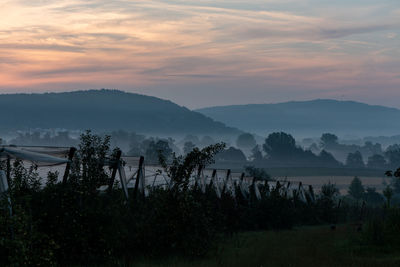 Scenic view of mountains against sky during sunset