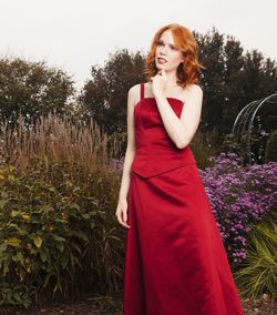 Low angle view of beautiful woman standing against plants