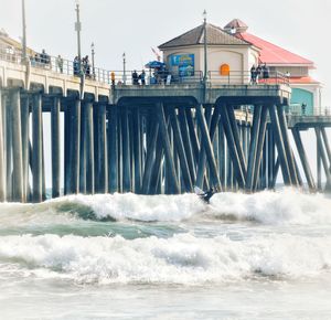 Built structure in sea against sky
