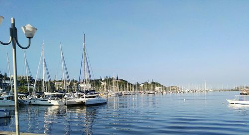 Boats moored at harbor