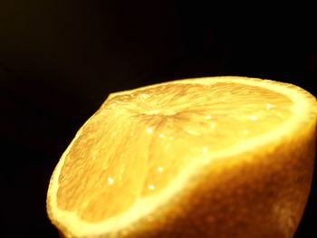 Close-up of lemon slice against black background