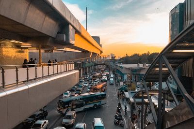 High angle view of road amidst buildings in city during sunset