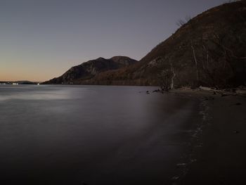 Scenic view of sea against clear sky during sunset