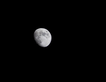 Low angle view of moon against sky at night