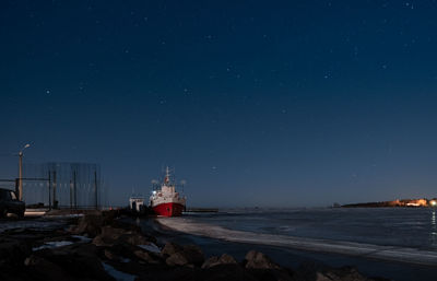 Scenic view of sea against sky at night