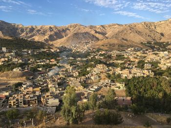 Aerial view of town against mountains