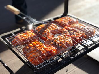 High angle view of meat on barbecue grill