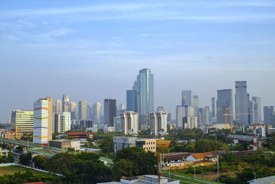 Buildings in city against sky