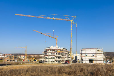 Germany, baden wurttemberg, sindelfingen, construction site with cranes