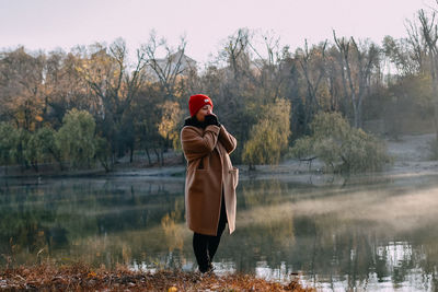 Rear view of man standing in lake