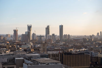 View of cityscape against sky during sunset