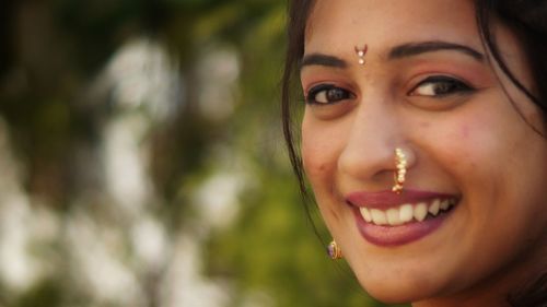 Close-up portrait of a smiling young woman