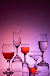 Glassware of different sizes against colorful background