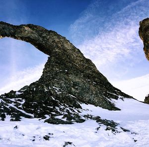 Scenic view of tree mountain against sky during winter