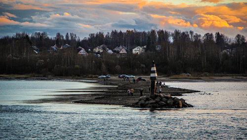 Scenic view of lake against sky during sunset