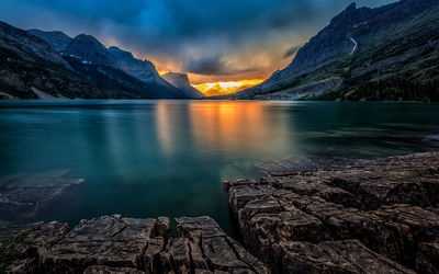 Calm lake along rocky landscape