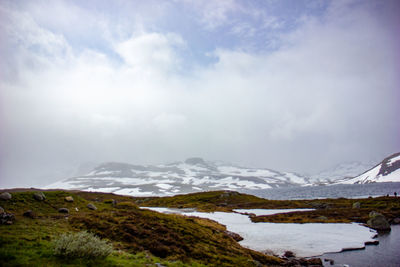 Scenic view of snowcapped mountains against sky