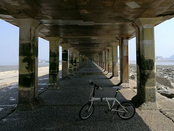 Interior of bridge over sea against sky