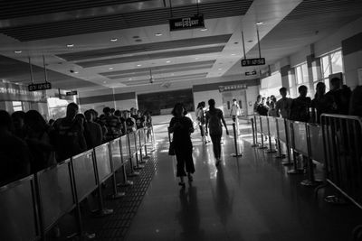 Group of people walking in airport