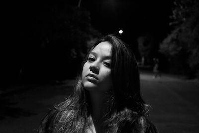 Portrait of a beautiful young woman looking away