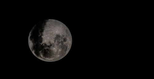 Low angle view of moon against sky at night