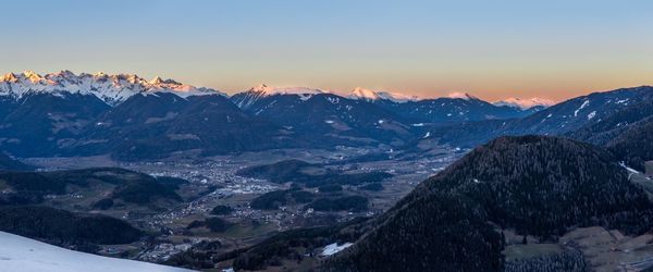 Aerial view of snowcapped mountain at sunset