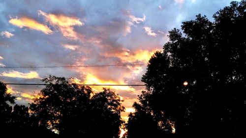 Low angle view of cloudy sky at sunset