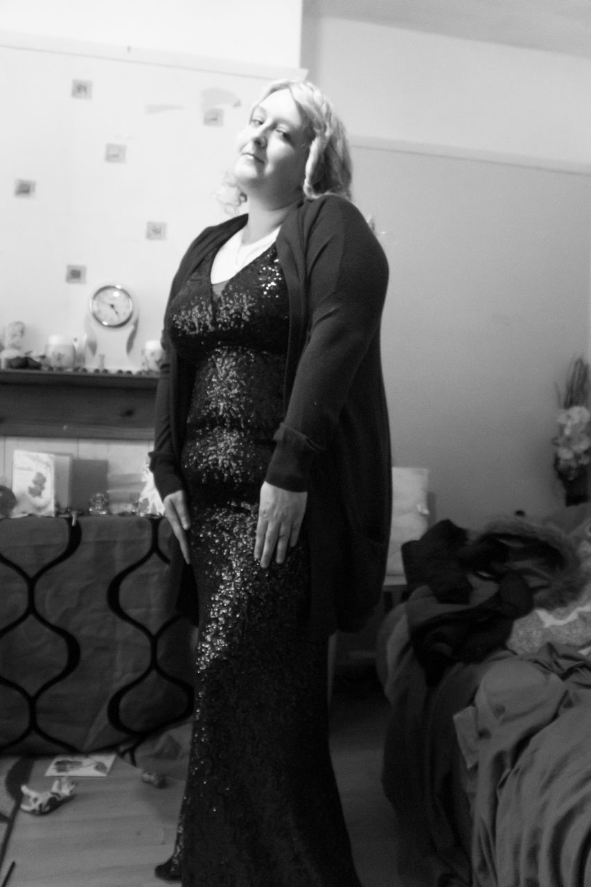 black, black and white, one person, adult, women, dress, indoors, clothing, fashion, monochrome photography, standing, monochrome, bride, white, female, young adult, photo shoot, lifestyles, full length, looking, gown, elegance, three quarter length, domestic room, wedding dress