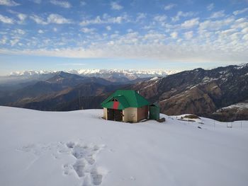 Scenic view of snowcapped mountains against sky during winter