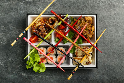 Directly above shot of seafood in plate on stone tray