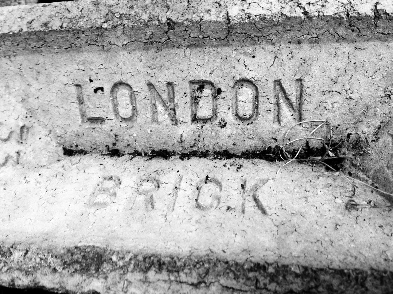 text, western script, communication, capital letter, non-western script, wall - building feature, information sign, information, sign, guidance, message, close-up, day, outdoors, no people, number, weathered, wall, abandoned, graffiti