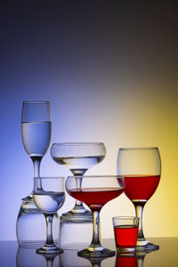 Glassware of different sizes against colorful background