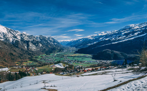 Scenic view of mountains against sky during winter