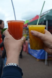 Close-up of hand holding drink