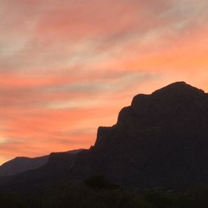 Scenic view of mountains at sunset