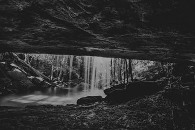 Scenic view of waterfall against sky