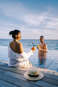 Couple enjoying in sea during vacation