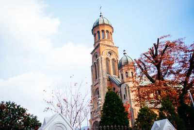 Low angle view of clock tower against sky