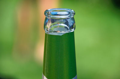 Close-up of glass bottle outdoors