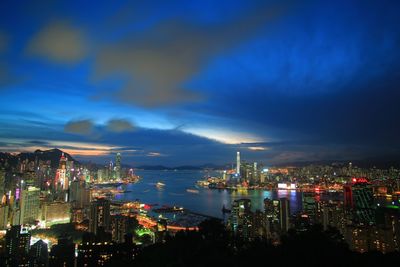 Aerial view of city lit up at night