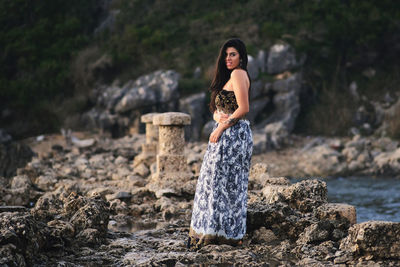 Woman standing on rock