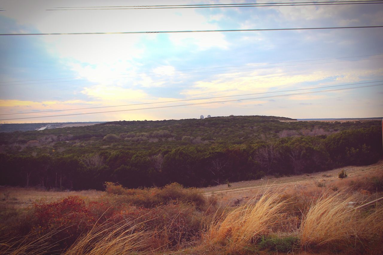 landscape, sky, tranquil scene, tranquility, sunset, scenics, field, beauty in nature, nature, cloud - sky, rural scene, cloud, horizon over land, plant, idyllic, grass, power line, non-urban scene, sunlight, sun